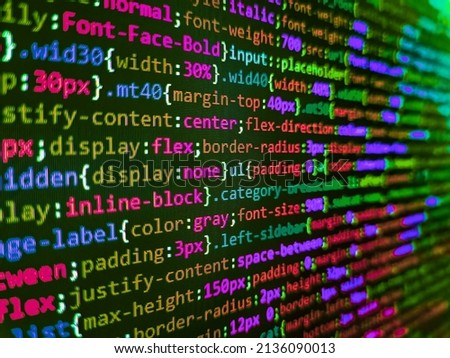 Abstract program code on computer screen. Front-end applications in the color concept. HTML5 concept macro backdrop in warm colors. 
