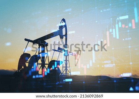 Abstract backlit oil pumping equipment on sky background with glowing growing candlestick forex chart. Trade, finance and economy concept. Double exposure