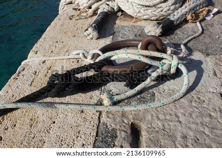 evocative image of the anchor point for boats in the port in a small
fishing village in Sicily, Italy 