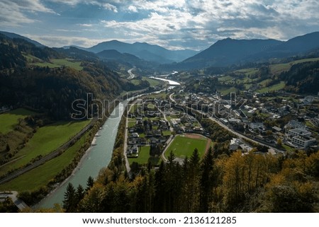 amazing view with mountains, river and small city from top of the castle in austria 2021