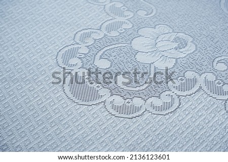 White tablecloth patterned with flowers