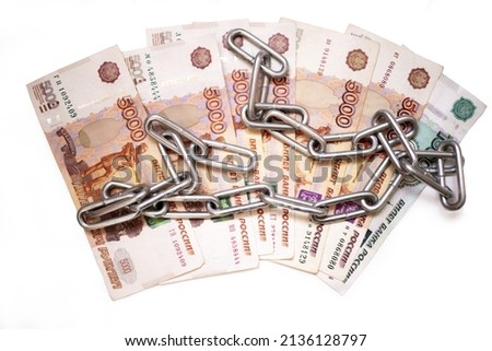 Russian money 5000 rubles  in chain  concept. prison. closed borders. economic struggle