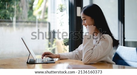 Business woman using digital tablet at office, account or saving money or insurance concept.