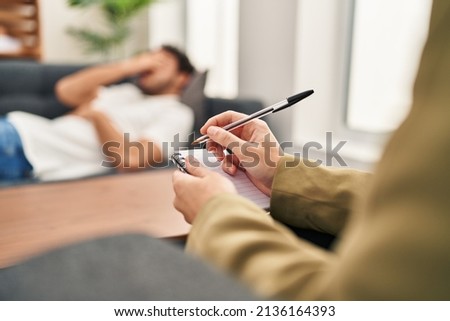 Man and woman having psychology session at psychology center Royalty-Free Stock Photo #2136164393