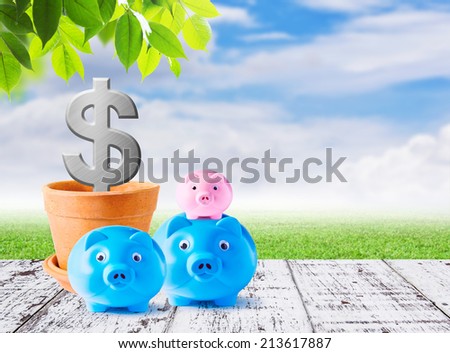 Business concepts of family piggybank on white wood