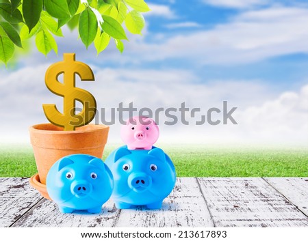Business concepts of family piggybank on white wood