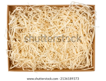 Empty cardboard box. Open box. Box with packing hay. Isolate on white Royalty-Free Stock Photo #2136189373