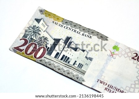 Reverse side of 200 two hundred Saudi riyals banknote features the Qasr Al Hukm in Riyadh City, selective focus of Saudi Arabia money banknote 1442 AH for vision 2030 program isolated on white