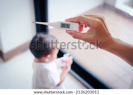Baby fever, Febrile seizures (febrile convulsions) in kid is concept Royalty-Free Stock Photo #2136203011