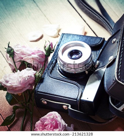 Vintage camera and roses