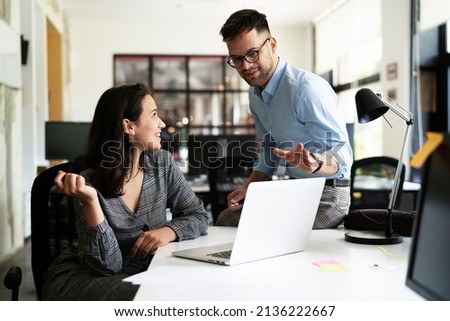 Colleagues in office. Businesswoman and businessman discussing work in office Royalty-Free Stock Photo #2136222667