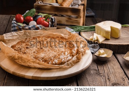 round cheese pie. Pictured are vegetables and cheese. food photo for restaurant