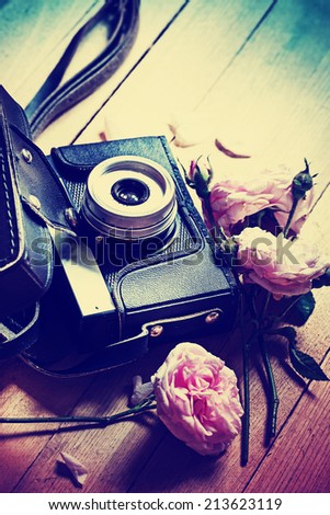Vintage camera and roses 