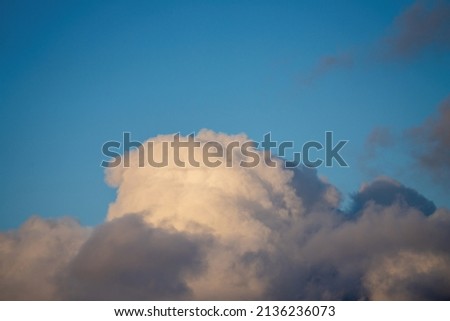 Puffy white cloud on clear blue sky Royalty-Free Stock Photo #2136236073