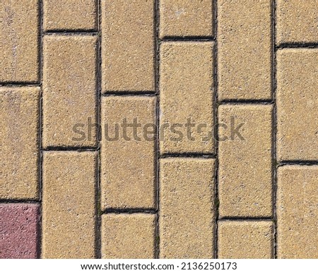The texture and color of the brickwork with a light brown tint.Background photo.