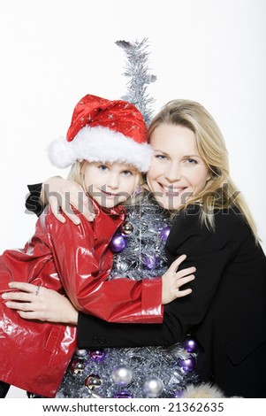 indoors picture of a little girl with her mother preparing christmas tree on isolated white background