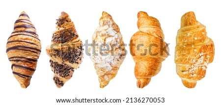 Set of croissants on a white isolated background. toning. selective focus Royalty-Free Stock Photo #2136270053