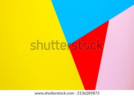 Abstract background with colored paper blue yellow red color.