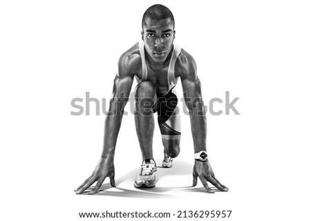 Runner on the start. Black and white image isolated on white. Royalty-Free Stock Photo #2136295957