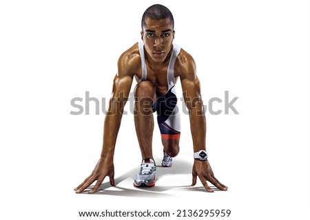 Athletic runner on the start. Sports background. Royalty-Free Stock Photo #2136295959