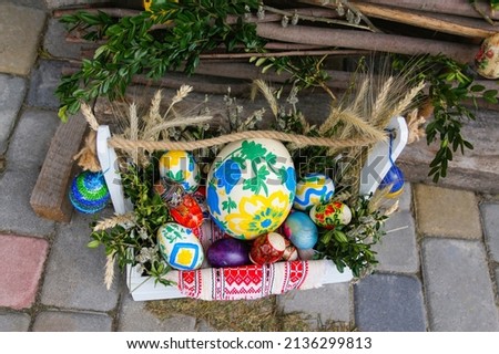 Easter eggs box. Handmade diy home exterior decoration with colorful easter eggs on white box.  Creativity craft concept. Ukrainian tradition. Top view.