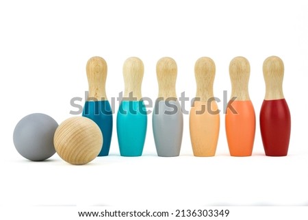 Wooden bowling set on white solid background