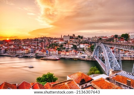 Porto Aerial Cityscape with Luis I Bridge and Douro River at Amazing Sunset, Portugal Royalty-Free Stock Photo #2136307643