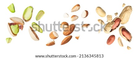 set raw cracked pistachios, almonds and peanut isolated on white background. Concept of Pistachios almonds and peanut is torn to pieces close-up. clipping path Royalty-Free Stock Photo #2136345813