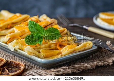 Crepes Suzette - French pancakes with orange liqueur sauce Royalty-Free Stock Photo #2136358491