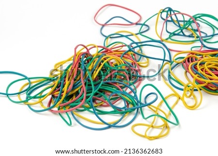 Colored rubber bands for money against white background. Close-up