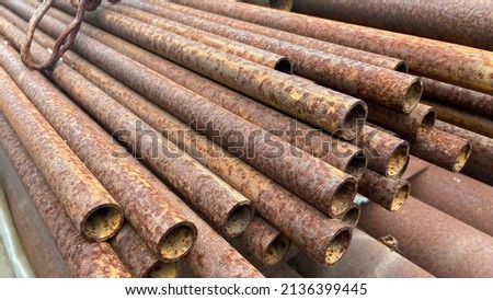 Rusty steel pipe,Steel pipes are placed in factory, steel pipe for fabrication,Stacked together of steel tube, close-up