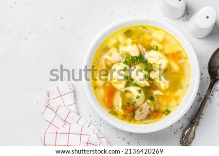 Chicken crock pot  soup with dumplings. Top view, copy space. Royalty-Free Stock Photo #2136420269