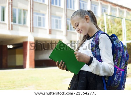 Back to school - portrait of beautiful young schoolgirl, education concept