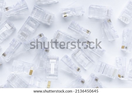 Transparent and clear ethernet internet rj-45 connectors, tehnology background on white, selective focus