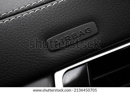 Safety airbag sign on car, luxury sport car interior background photo Royalty-Free Stock Photo #2136450705