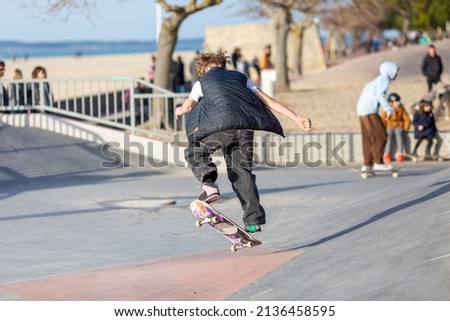 young man jumping in a skatepark

