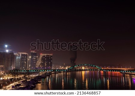 Beautiful scenic view over city center and business district at night with reflection in water at river Sava in Belgrade Waterfront. Belgrade, Serbia Royalty-Free Stock Photo #2136468857