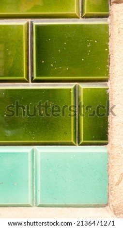Aged ceramic tile street wall