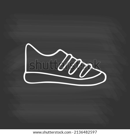 Hand drawn sports sneakers on chalkboard. White outline on black background. Cute element in doodle style for card, social media banner, sticker, decoration kids playroom. Vector illustration.