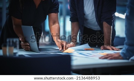 Office Conference Room Meeting: Diverse Team of Top Managers Talk, Brainstorm, Use Digital Tablet. Business Partners Discuss Financial Reports, Plan Investment Strategy. Team of Three Royalty-Free Stock Photo #2136488953