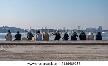 A group of people having lunch on Riddarholm. A wonderful place in beautiful Stockholm, Sweden. One of the most scenic, romantic city on earth. Scandinavias Venice with its many islands and connecting