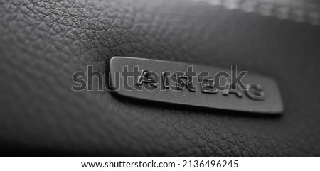 Safety airbag sign on car, luxury sport car interior background photo Royalty-Free Stock Photo #2136496245