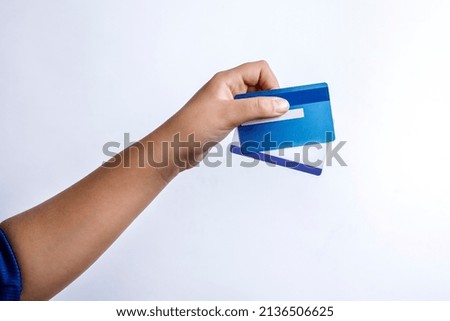hand holds two credit cards and shows them, isolated on white background
