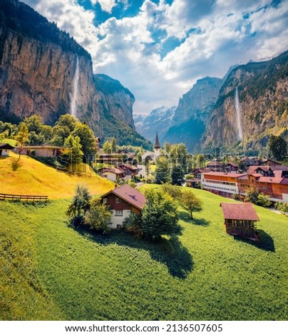 Captivating summer view of waterfall in Lauterbrunnen village. Gorgeous outdoor scene in Swiss Alps, Bernese Oberland in the canton of Bern, Switzerland, Europe. Traveling concept background. Royalty-Free Stock Photo #2136507605