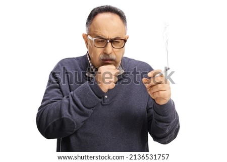 Mature man holding a cigarette and coughing isolated on white background Royalty-Free Stock Photo #2136531757