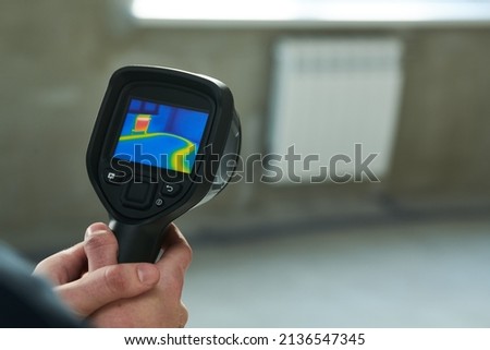 thermal imaging camera inspection for temperature check and finding heating pipes in floor Royalty-Free Stock Photo #2136547345