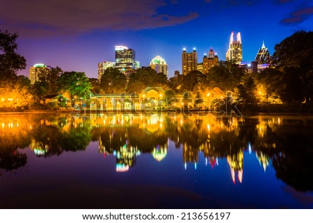 The Atlanta skyline reflecting in Lake Clara Meer in Piedmont Park in Atlanta, Georgia.