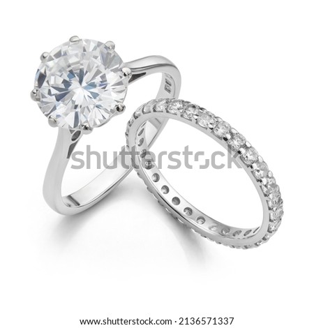 Diamond Solitaire Ring with Wedding Band Isolated on White Background Royalty-Free Stock Photo #2136571337