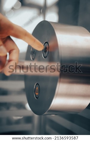 Finger is pushing lift Open Close and Alarm button. Elevator lift buttons keypad. Push car operating panel, COP panel pressing. Calling the lift inside the cabin.  Royalty-Free Stock Photo #2136593587