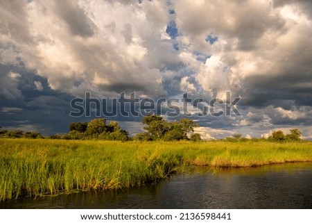 Storm clouds with ripped sky and sun at Chobe River, Botswana